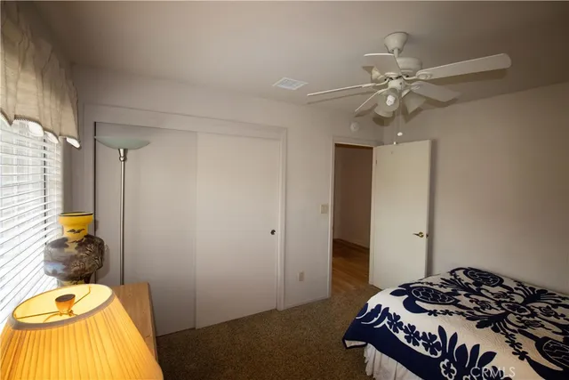 a white toilet sitting next to a shower curtain