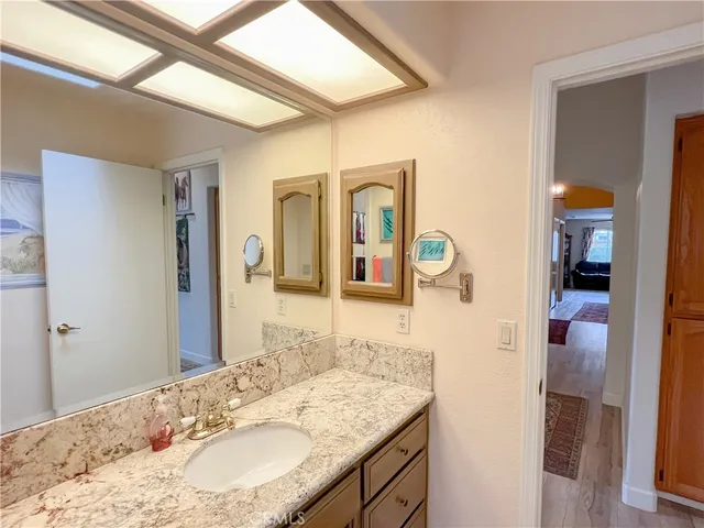 a living room with furniture a rug and a chandelier