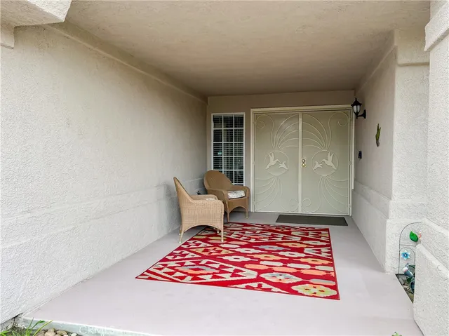 an entryway with a rug