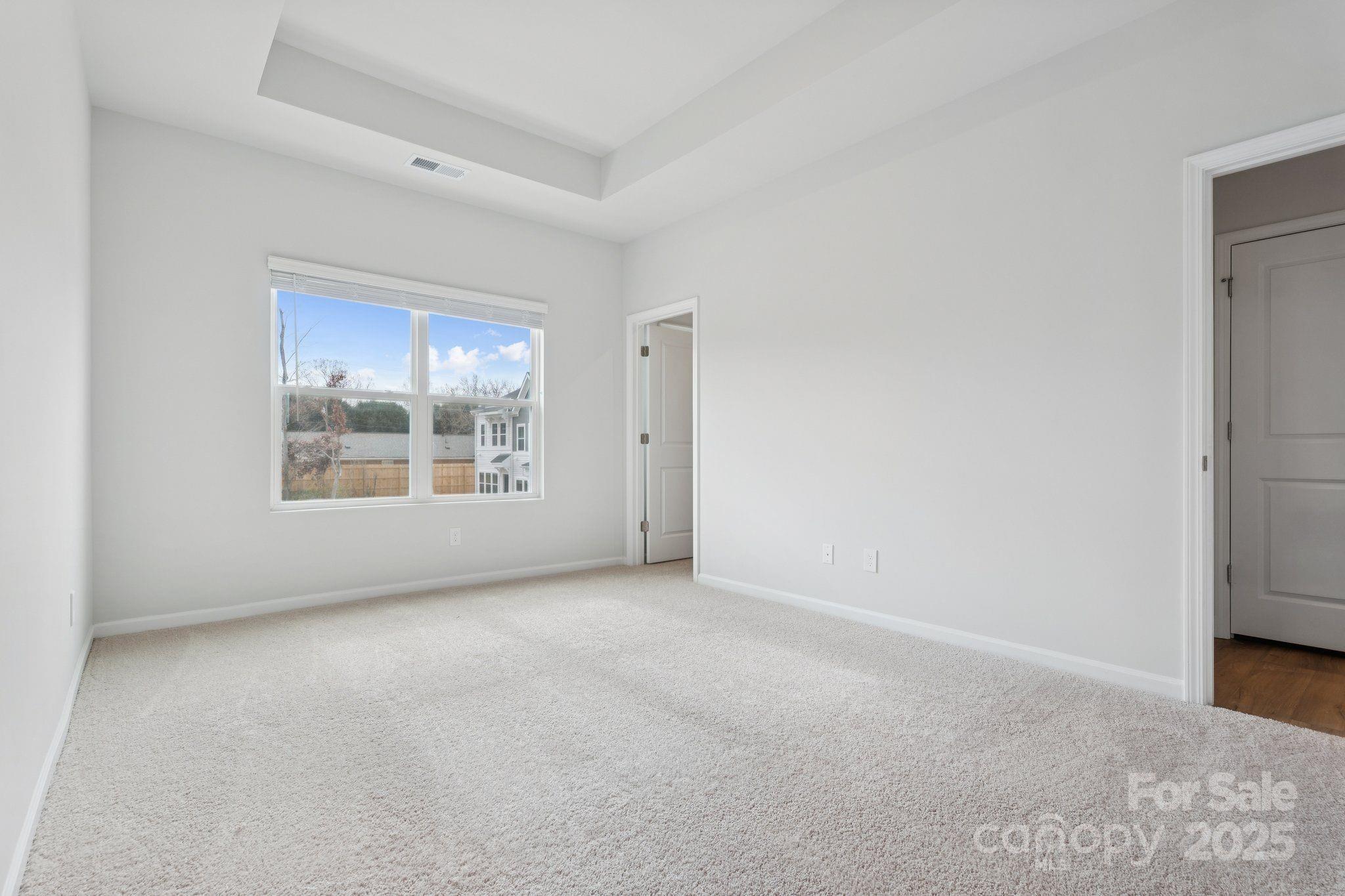 4742 Lakeview Road, Unit 17 Charlotte, NC 28216 - Photo 16 of 27 an empty room with windows