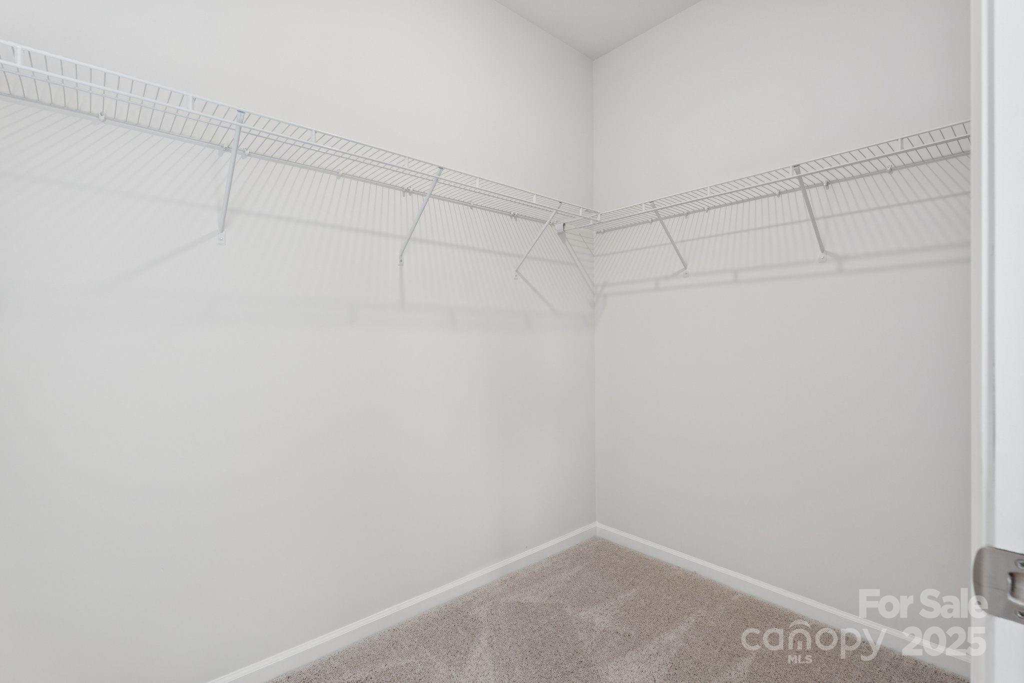 4742 Lakeview Road, Unit 17 Charlotte, NC 28216 - Photo 18 of 27 a view of a room with racks on the wall