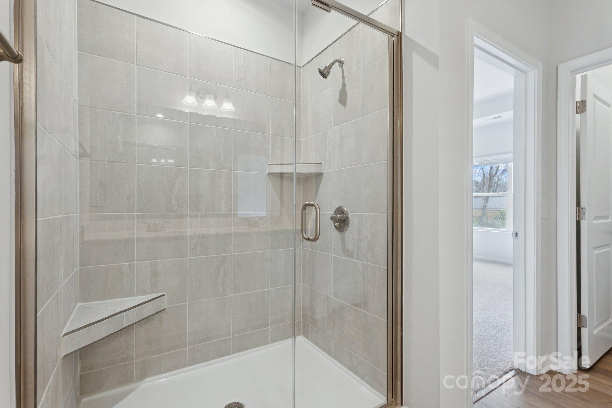4742 Lakeview Road, Unit 17 Charlotte, NC 28216 - Photo 20 of 27 a bathroom with a shower and a sink