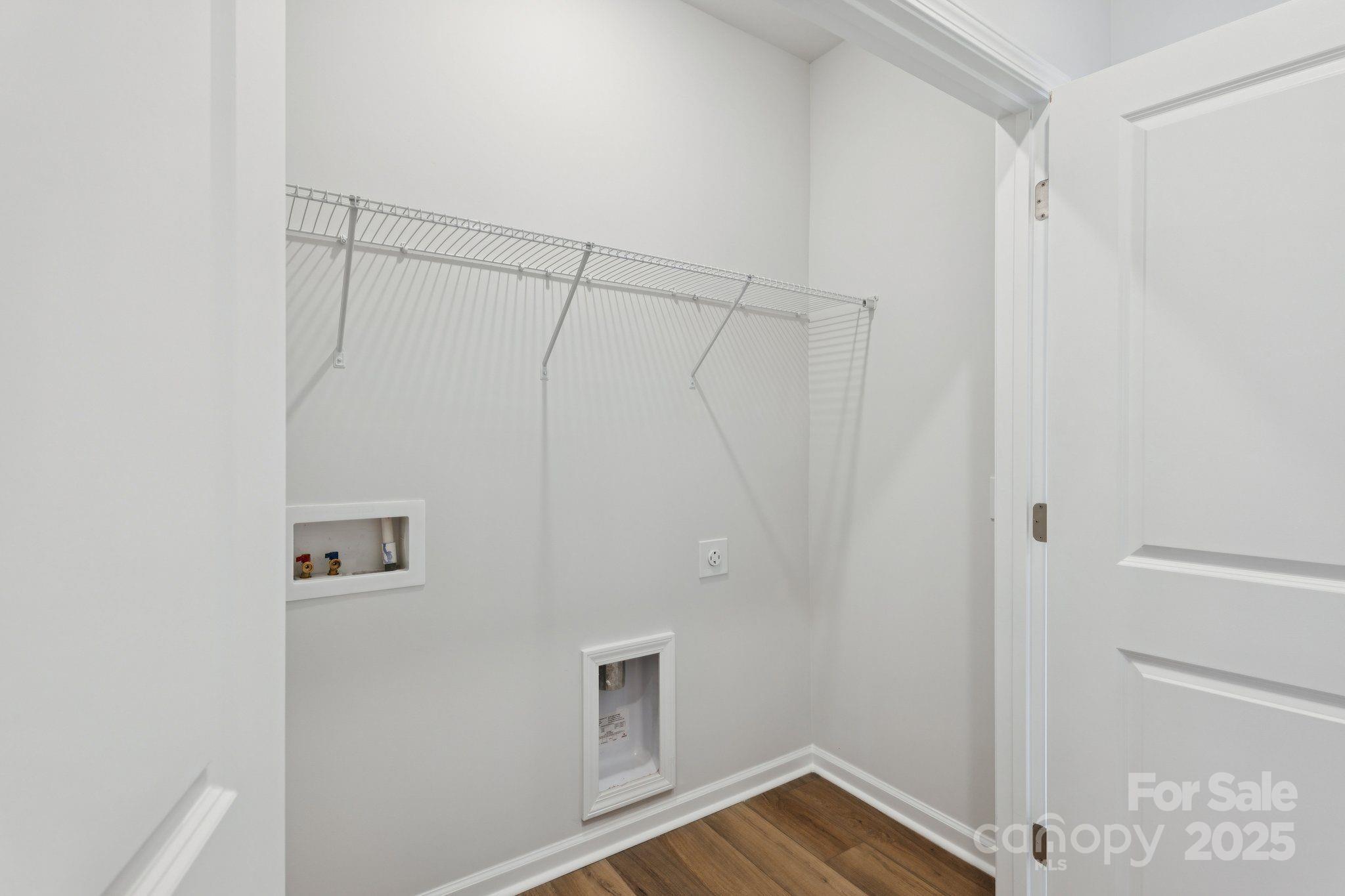4742 Lakeview Road, Unit 17 Charlotte, NC 28216 - Photo 21 of 27 a view of storage and utility room with wooden floor