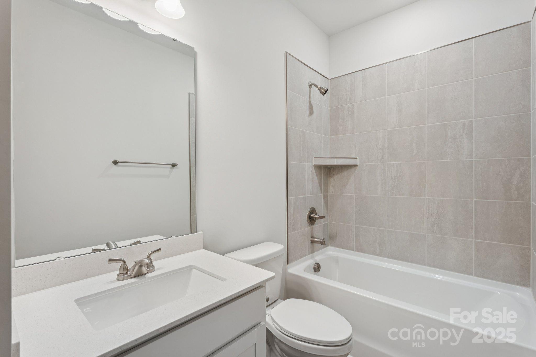 4742 Lakeview Road, Unit 17 Charlotte, NC 28216 - Photo 27 of 27 a bathroom with a sink toilet and shower
