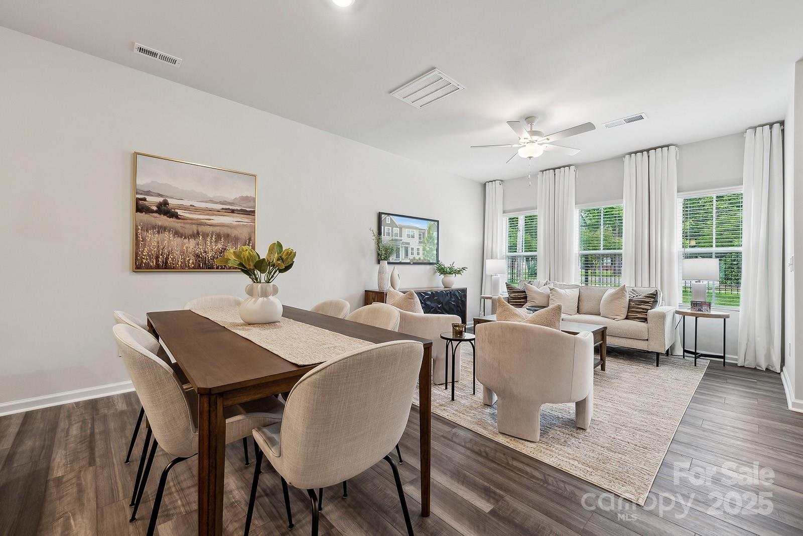 4742 Lakeview Road, Unit 17 Charlotte, NC 28216 - Photo 5 of 27 a view of a dining room with furniture window and wooden floor