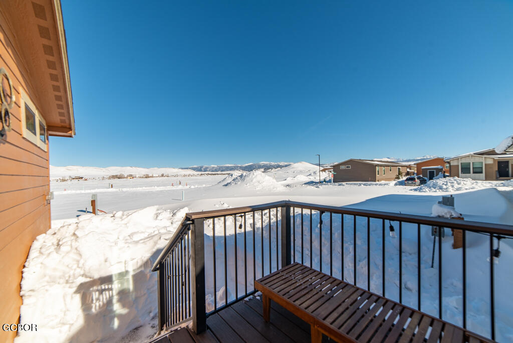 551 Summit Trail, Unit 199 Granby, CO 80446 - Photo 29 of 34 a view of a roof deck with wooden floor and fence