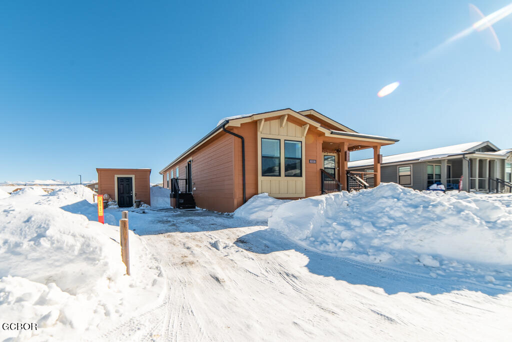 551 Summit Trail, Unit 199 Granby, CO 80446 - Photo 30 of 34 a front view of a house with a yard