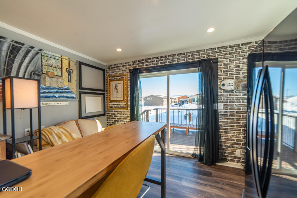 551 Summit Trail, Unit 199 Granby, CO 80446 - Photo 8 of 34 a living room with stainless steel appliances furniture wooden floor and a large window
