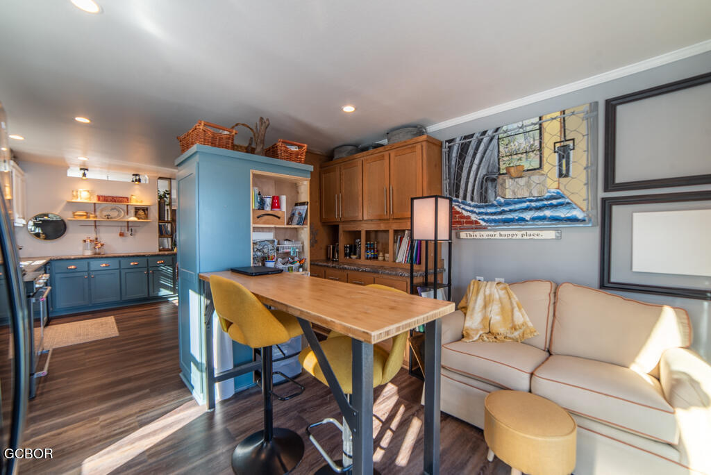 551 Summit Trail, Unit 199 Granby, CO 80446 - Photo 10 of 34 a living room with furniture and a table