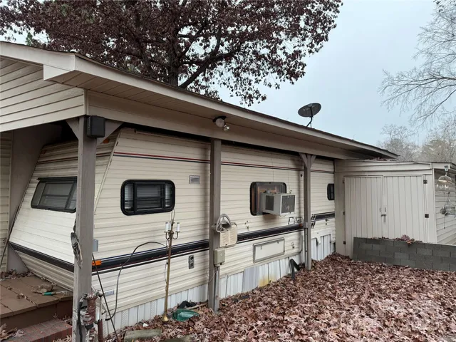 a view of a house with a flat screen tv