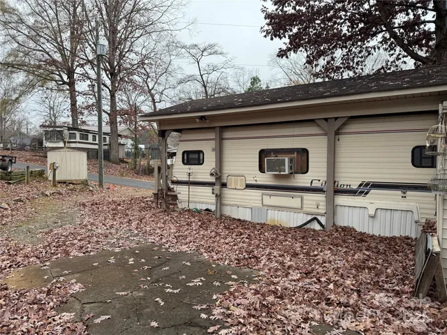 a view of a small house and a yard