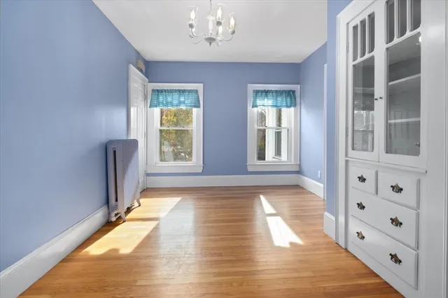 a view of an entryway with wooden floor and windows