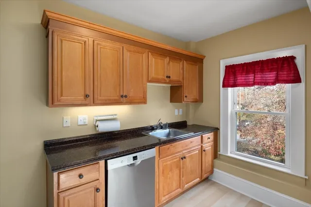 a kitchen with stainless steel appliances granite countertop a stove a sink and a granite counter tops