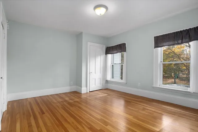 a bathroom with a toilet a sink a shower and mirror