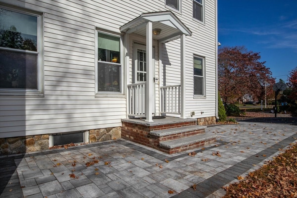 33 Dunbar Street, Unit 33 Canton, MA 02021 - Photo 34 of 42 a front view of a house with a yard
