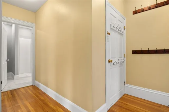 a view of front door with wooden floor