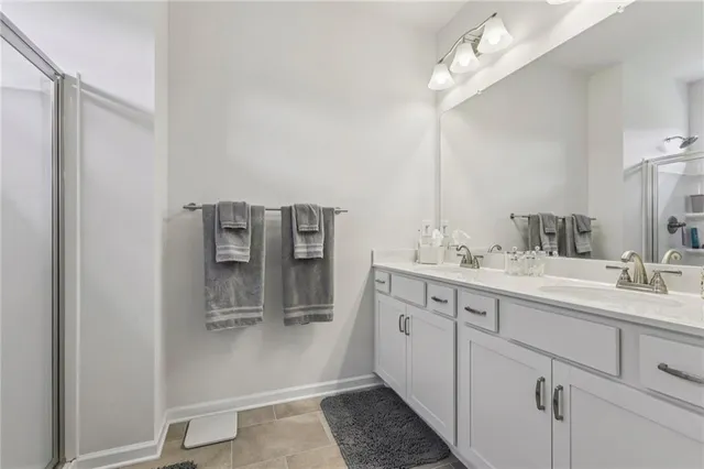 a bathroom with a glass shower door