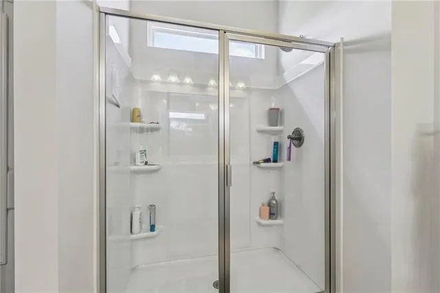 a bathroom with double sink and a mirror