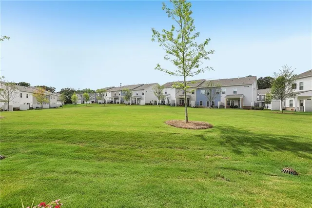a aerial view of a house with a yard