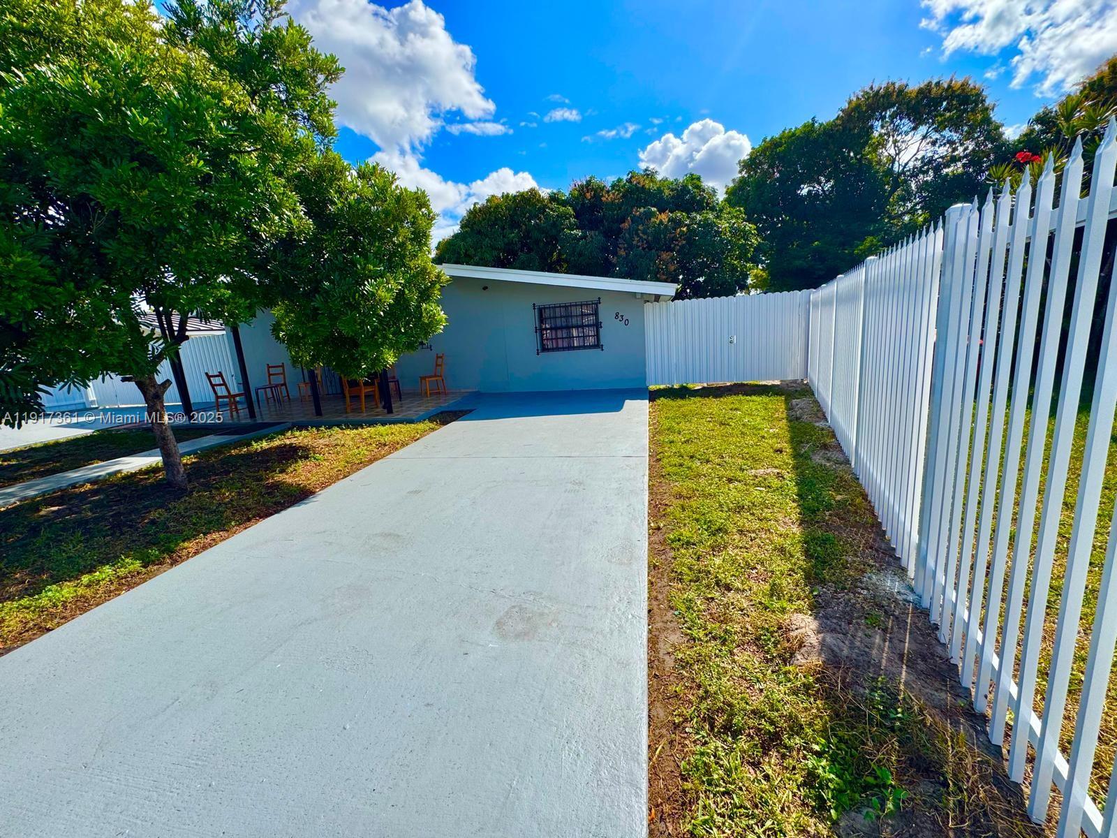 830 Southeast 7th Place Hialeah, FL 33010 - Photo 3 of 19 a view of swimming pool with a yard
