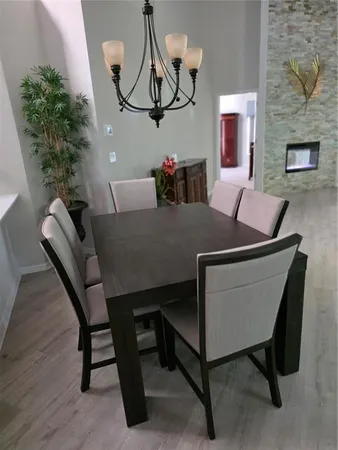 a dining room with furniture and window