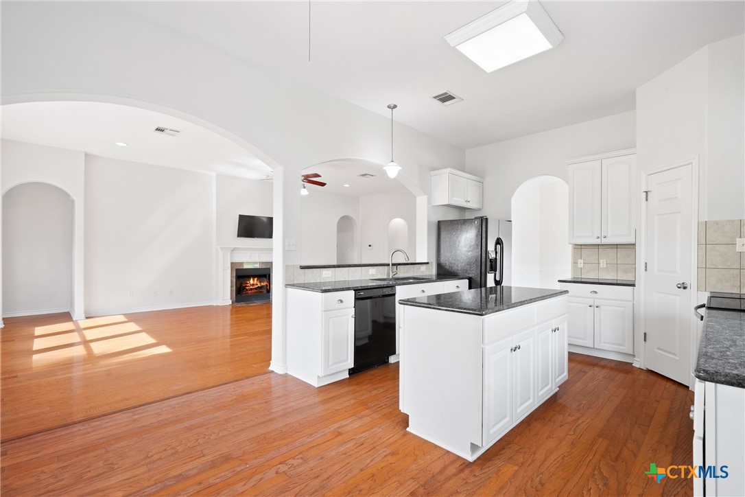 12312 Blackberry Road Salado, TX 76571 - Photo 13 of 46 a kitchen with white cabinets and sink