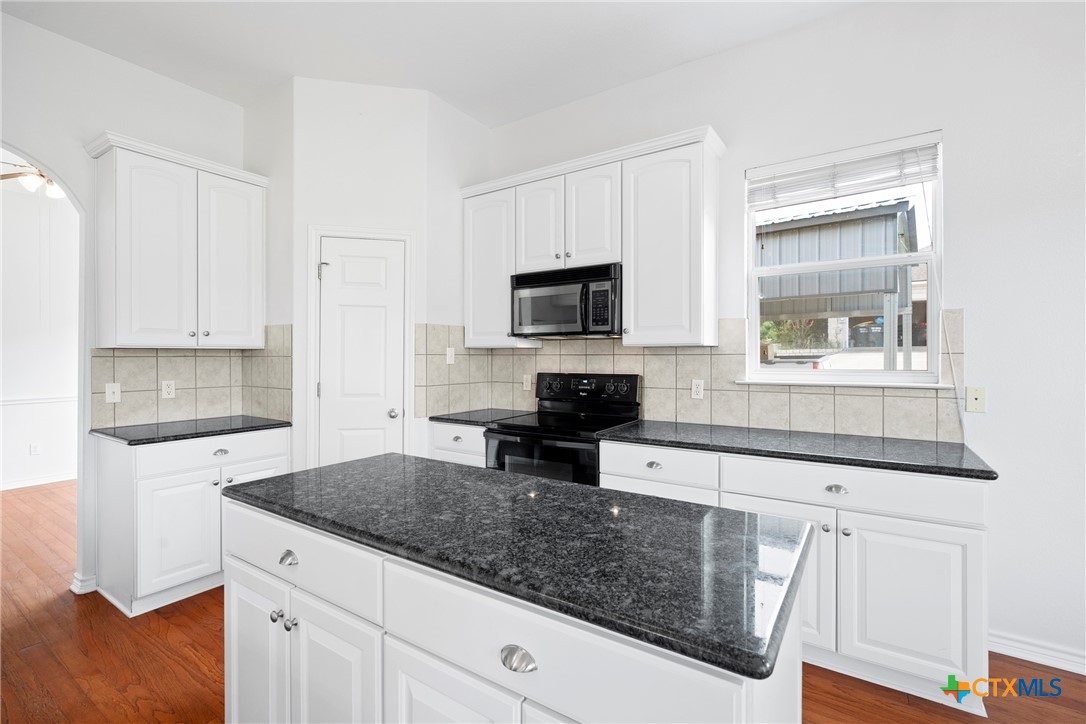 12312 Blackberry Road Salado, TX 76571 - Photo 16 of 46 a kitchen with white cabinets and appliances