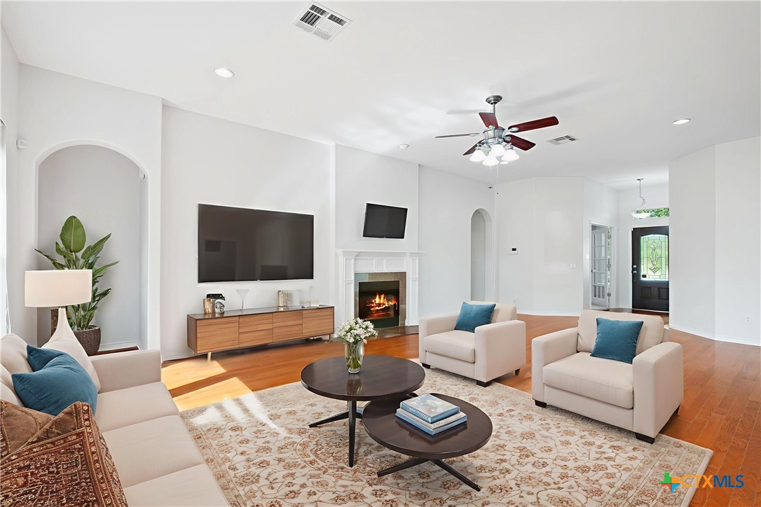 12312 Blackberry Road Salado, TX 76571 - Photo 2 of 46 a living room with furniture a rug and a flat screen tv