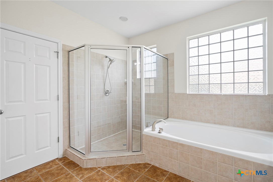 12312 Blackberry Road Salado, TX 76571 - Photo 25 of 46 a bathroom with a bathtub and a shower