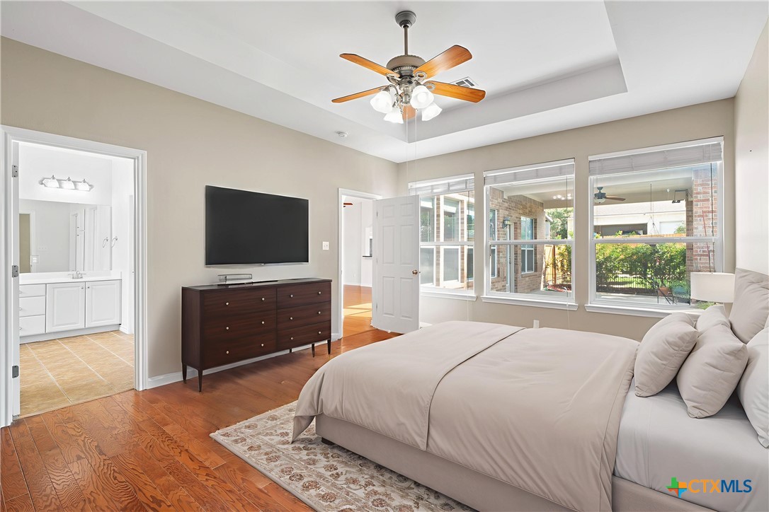 12312 Blackberry Road Salado, TX 76571 - Photo 3 of 46 a bedroom with a bed and a flat screen tv