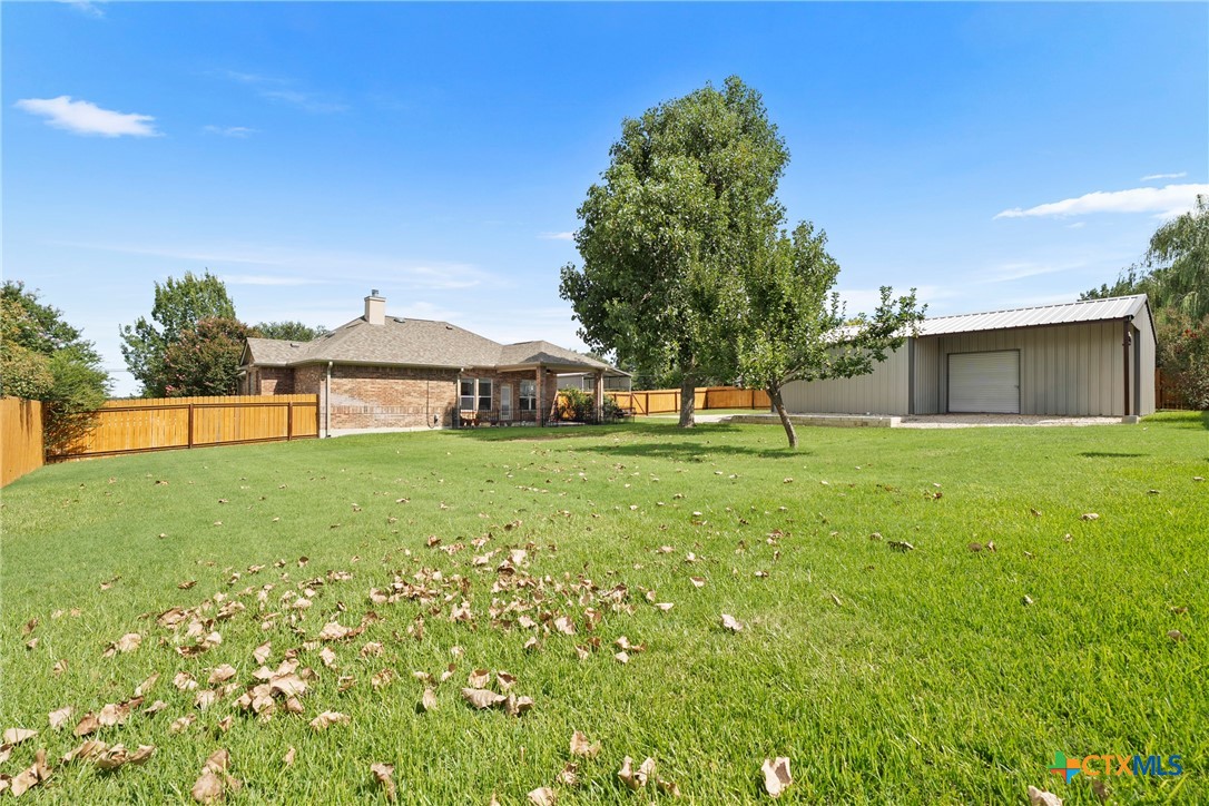 12312 Blackberry Road Salado, TX 76571 - Photo 31 of 46 a view of an house with backyard space and tree