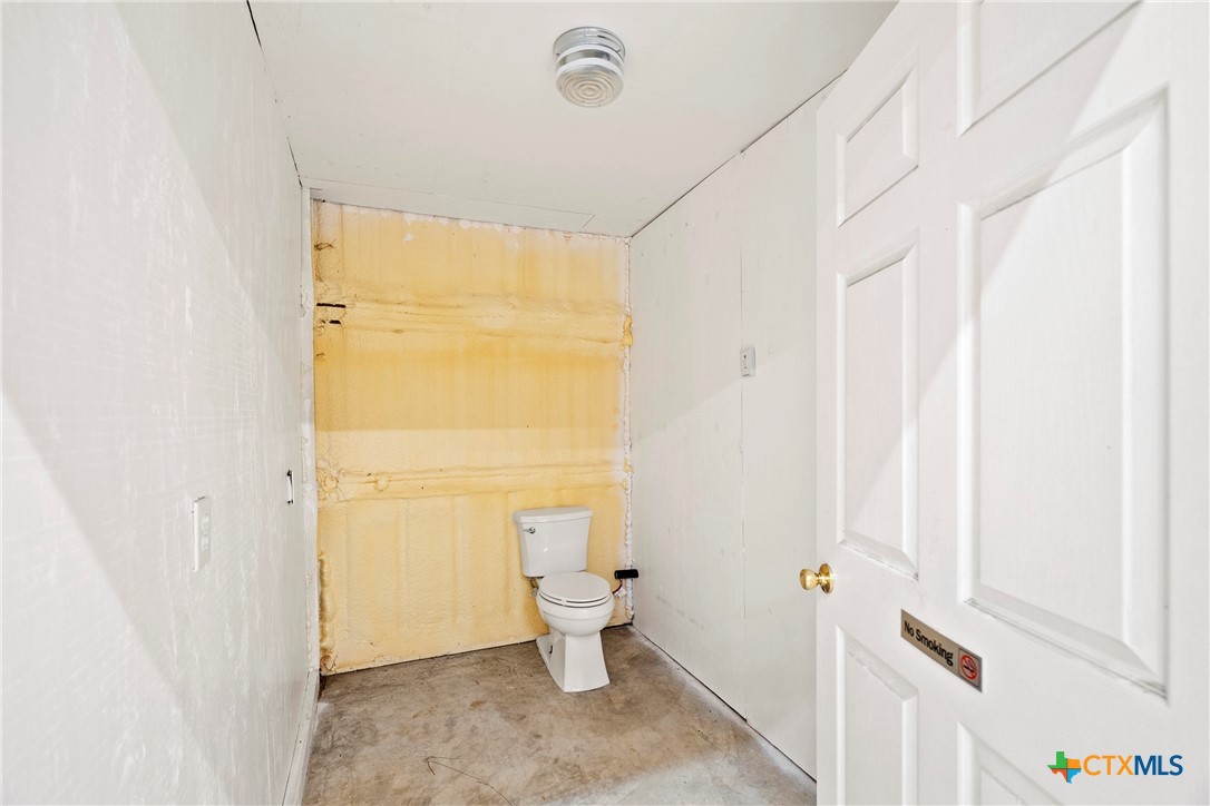 12312 Blackberry Road Salado, TX 76571 - Photo 38 of 46 a bathroom with a toilet sink and a shower