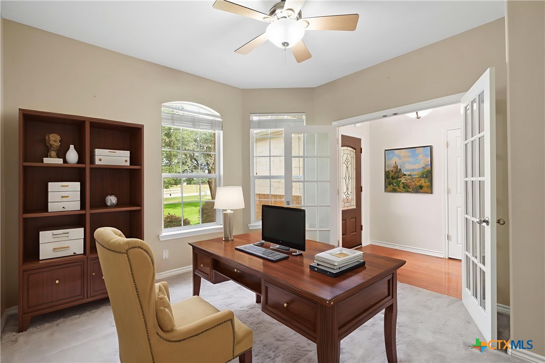 12312 Blackberry Road Salado, TX 76571 - Photo 4 of 46 a living room with furniture a large window and a flat screen tv