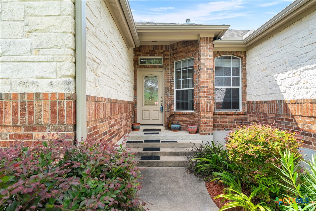 12312 Blackberry Road Salado, TX 76571 - Photo 7 of 46 a front view of a house with a garden