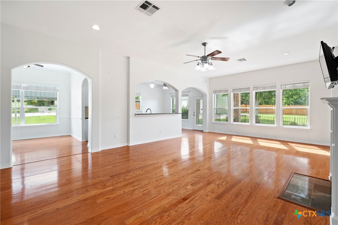 12312 Blackberry Road Salado, TX 76571 - Photo 9 of 46 a view of an empty room with window and wooden floor