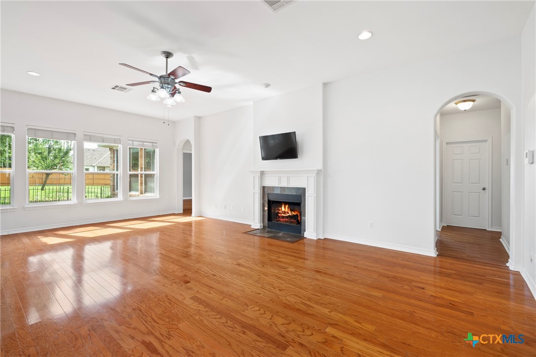 12312 Blackberry Road Salado, TX 76571 - Photo 10 of 46 a view of empty room with wooden floor and fan