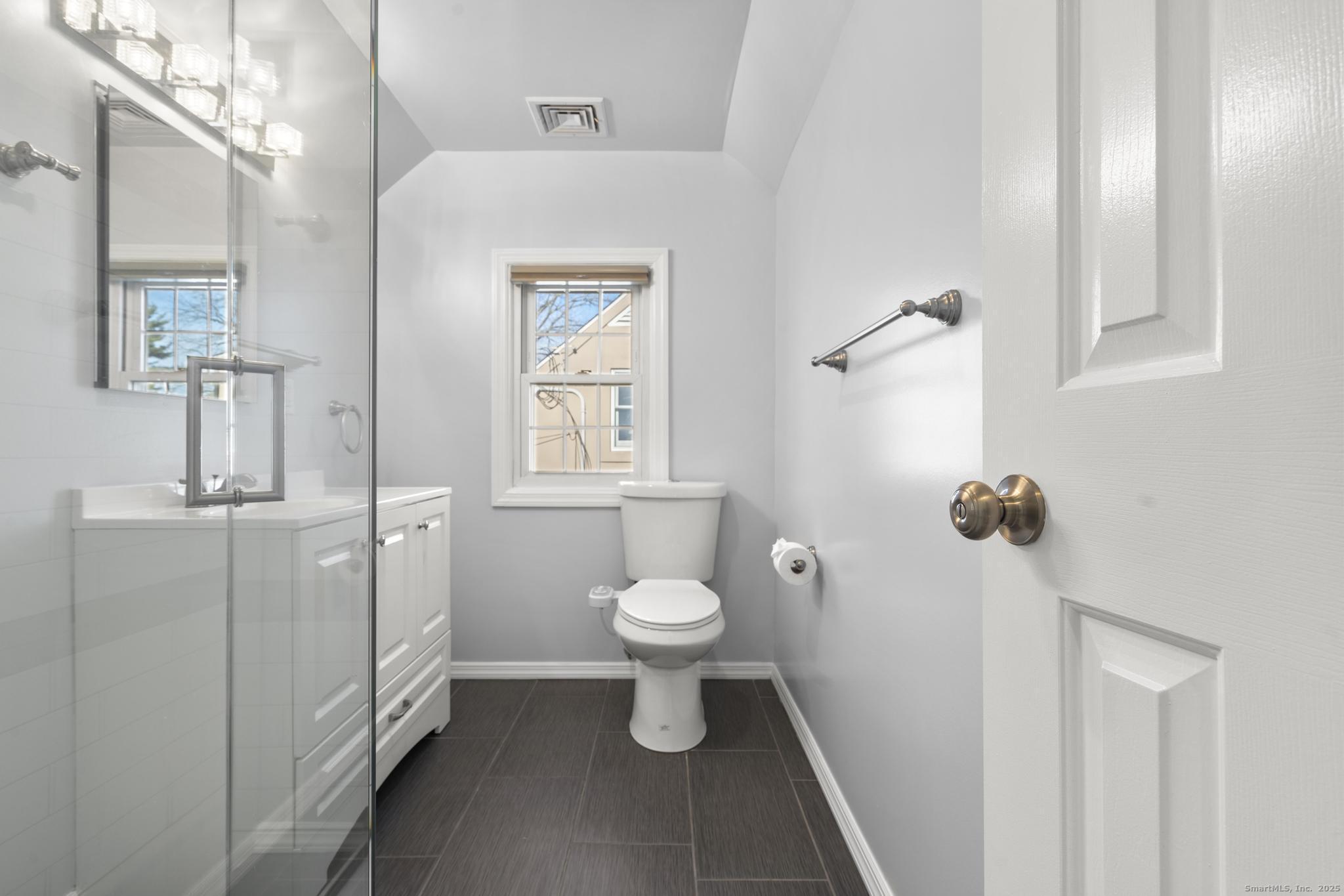 16 Silk Street Norwalk, CT 06850 - Photo 11 of 34 a bathroom with a sink a toilet and shower