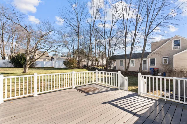 a view of a house with wooden fence