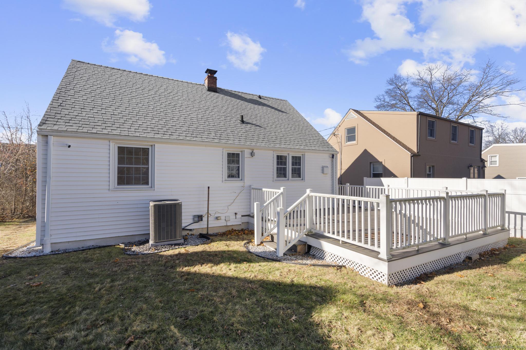 16 Silk Street Norwalk, CT 06850 - Photo 19 of 34 a view of a house with a wooden fence
