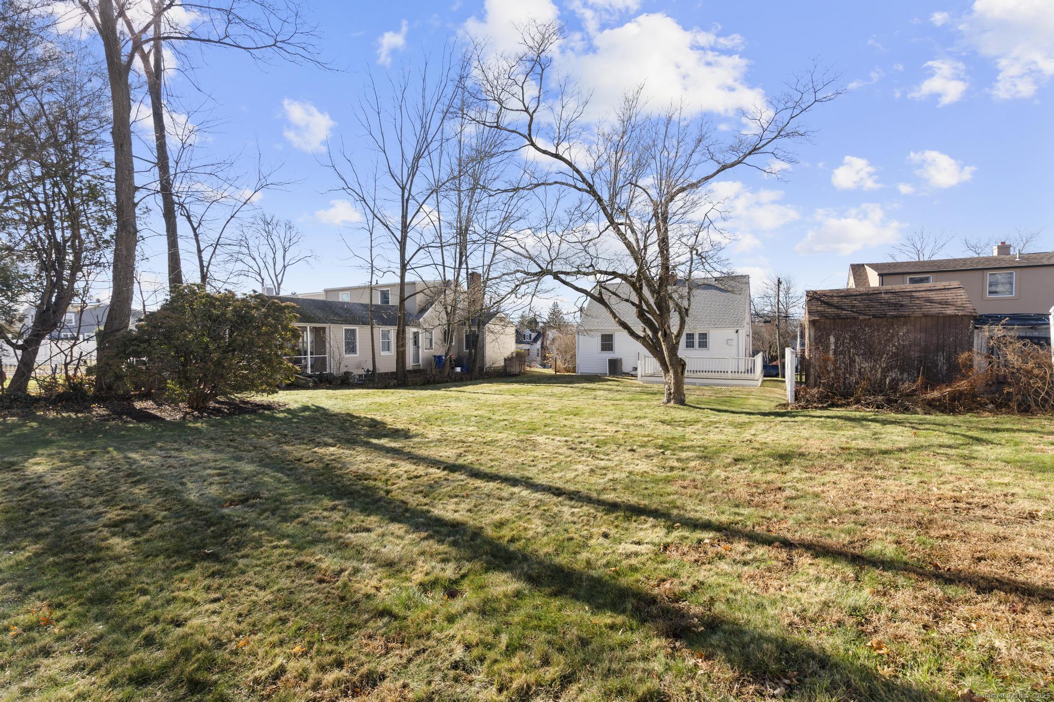 16 Silk Street Norwalk, CT 06850 - Photo 22 of 34 a view of a yard with a large tree