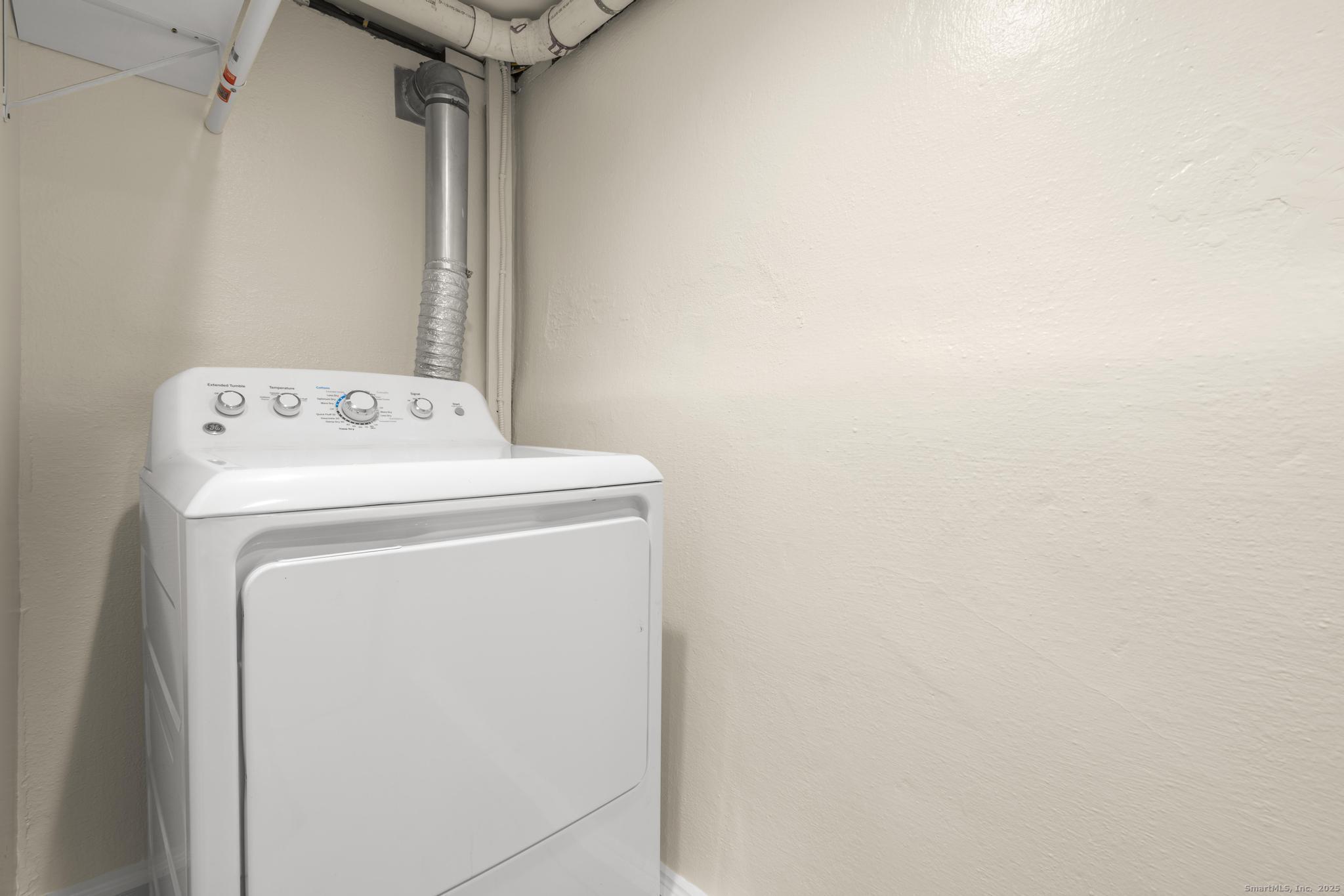 16 Silk Street Norwalk, CT 06850 - Photo 29 of 34 a utility room with dryer and washer