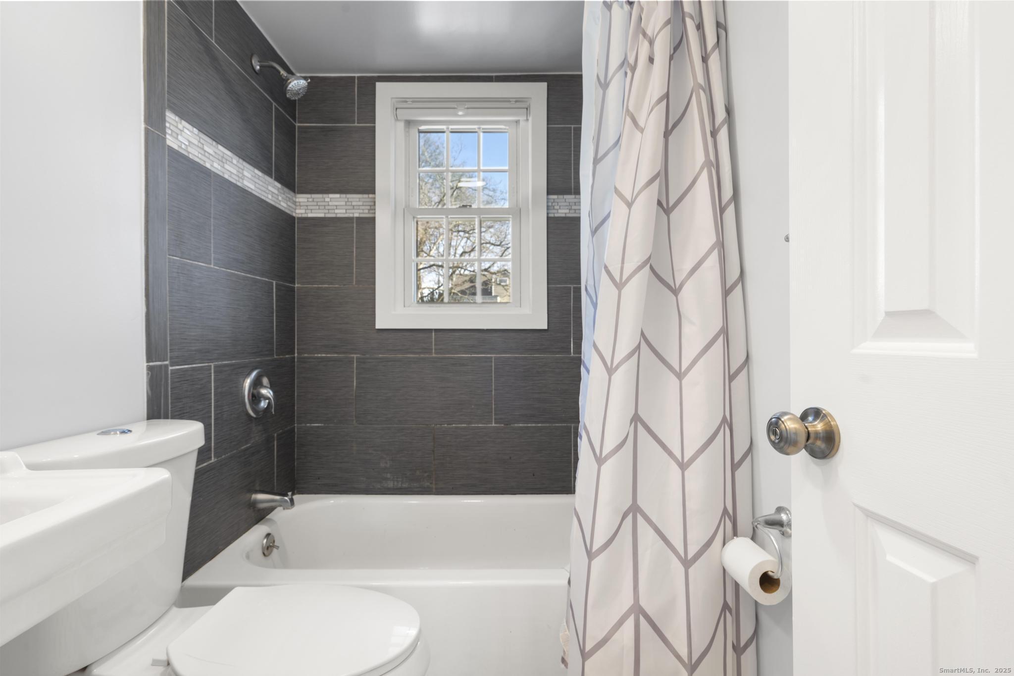 16 Silk Street Norwalk, CT 06850 - Photo 7 of 34 a bathroom with a toilet and shower