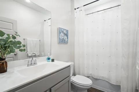 a view of an empty room with a kitchen