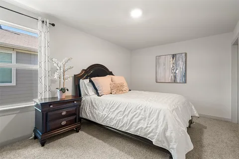 a bathroom with a sink a toilet and shower curtain