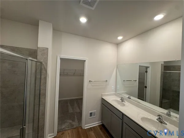 a bathroom with a glass shower door