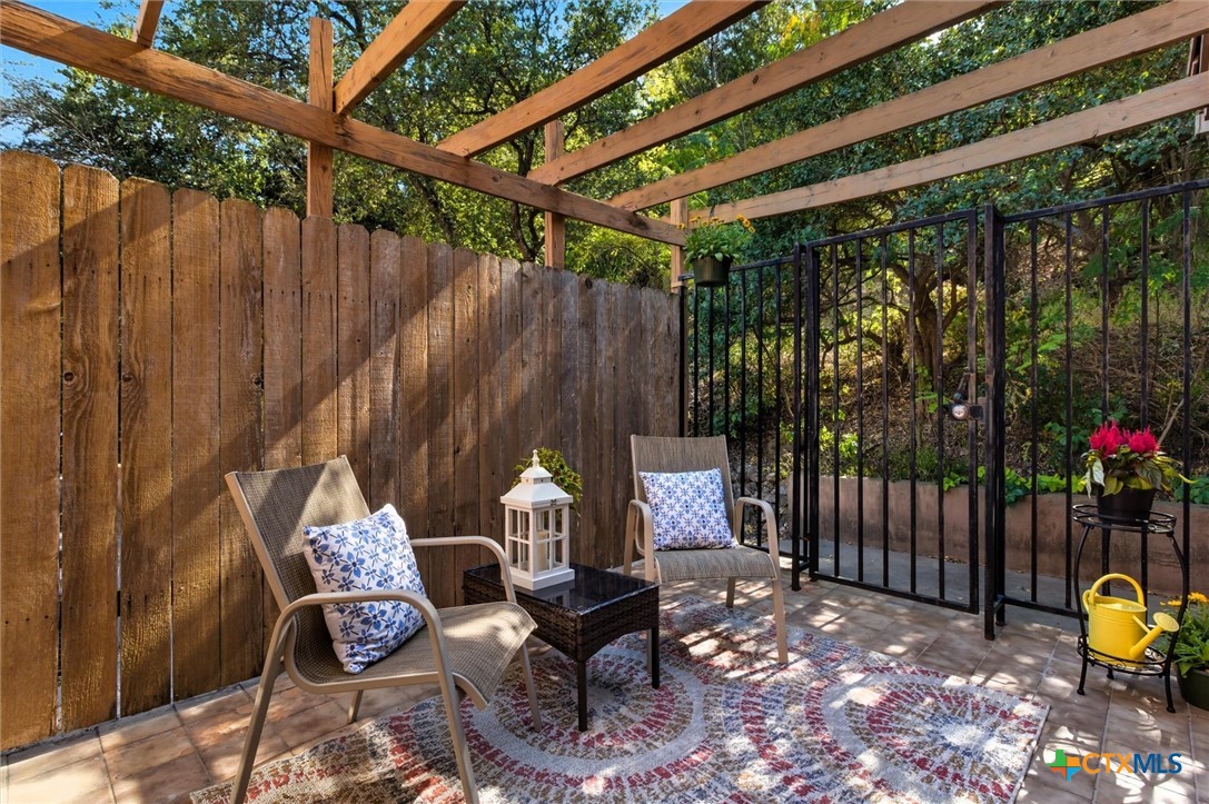 821 Ranch Road 12 San Marcos, TX 78666 - Photo 18 of 30 a view of a chairs and table in the backyard
