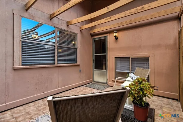 an aerial view of a house with a yard and garden