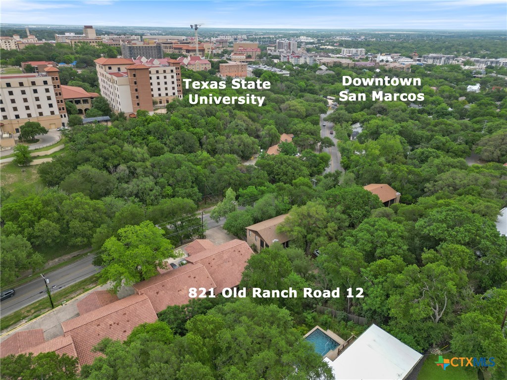 821 Ranch Road 12 San Marcos, TX 78666 - Photo 21 of 30 an aerial view of a residential apartment building with a yard and lake view