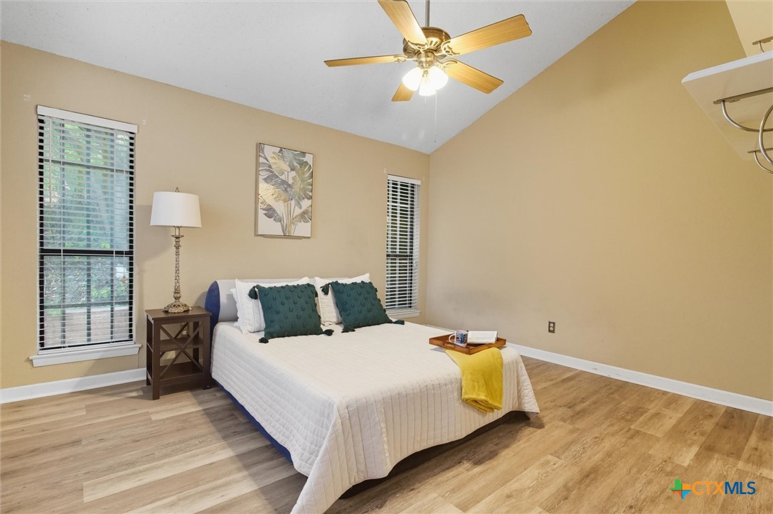 821 Ranch Road 12 San Marcos, TX 78666 - Photo 8 of 30 a bedroom with a bed and wooden floor