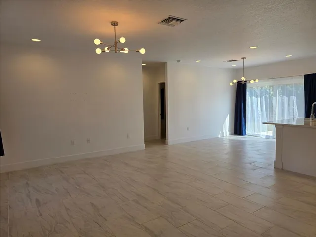 a view of a livingroom with a kitchen